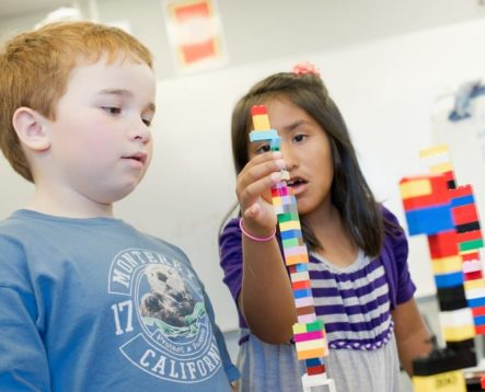 Campers using plastic building blocks