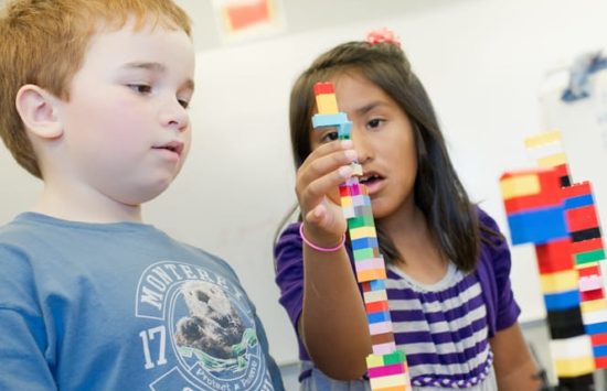 Campers using plastic building blocks